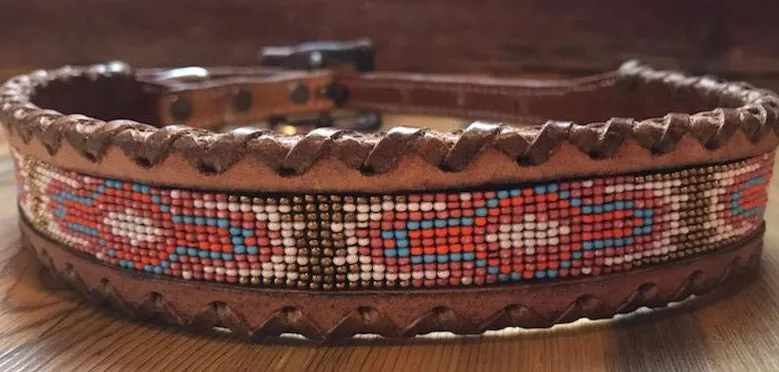 Genuine leather dog collar with pink, white, and gold navajo beaded inlay design, a leather wrapped edge